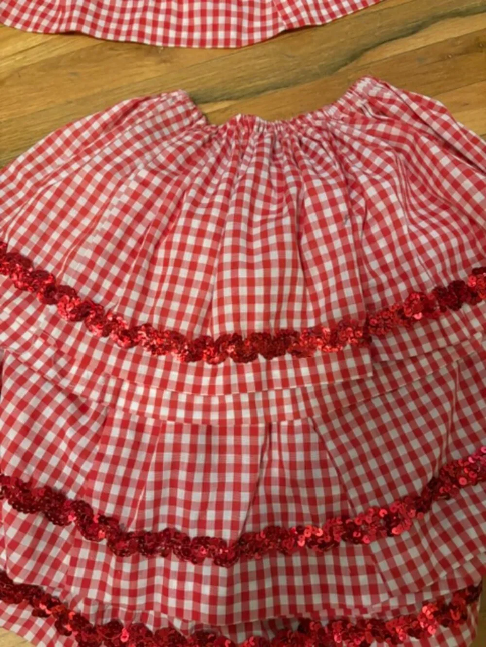 Eight Red Country Recital Skirts with Sashes